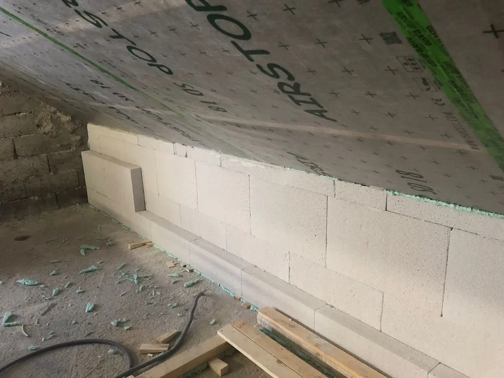 The second layer of Multipor being installed along the south wall. We installed two 100 mm layers for a total thickness of 200 mm.