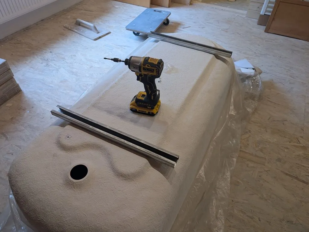 Attaching the legs to the bathtub.