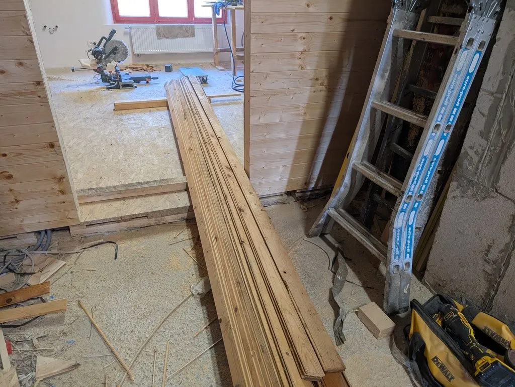 The original tongue and groove ceiling boards, ready for reinstallation.