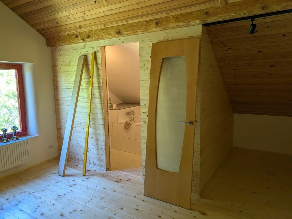 The bathroom rough opening and door, ready for installation.