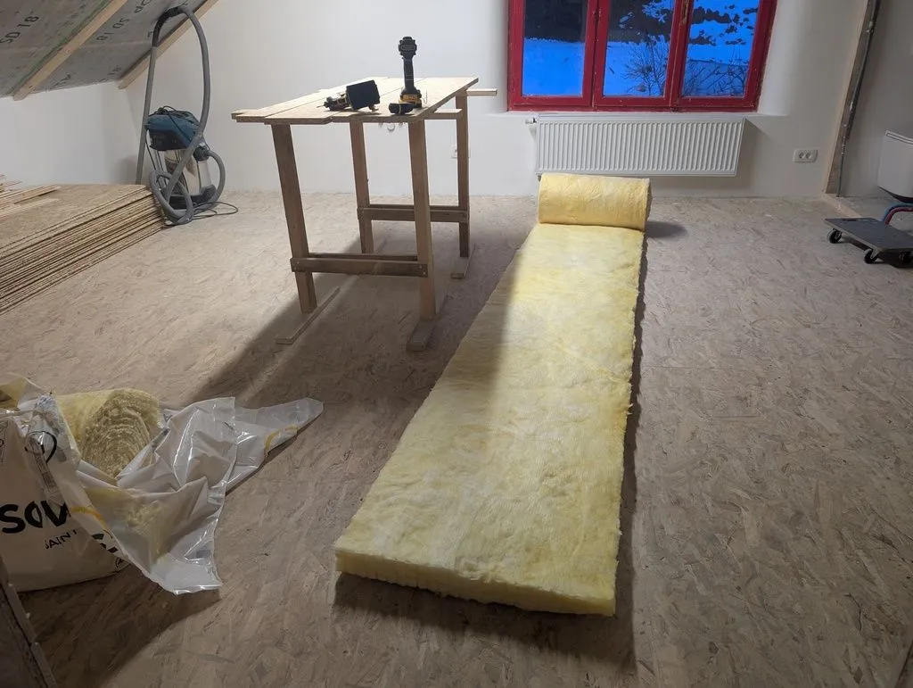 A batt of glass wool, rolled out and ready for installation.