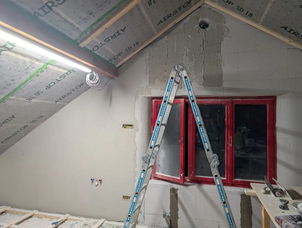 The base coat progressing along the wall