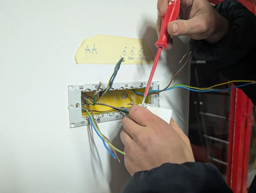 Making the electrical connections for the switch controlling the ridge light.