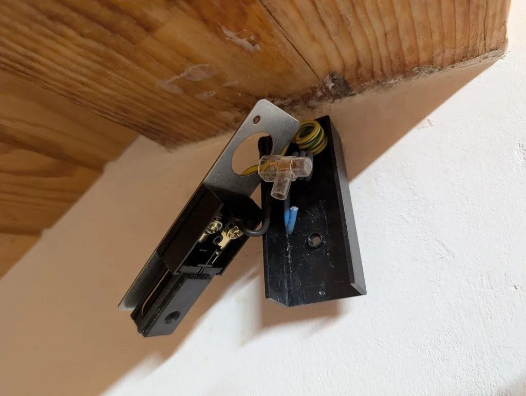 Making the connections to the terminal block that powers the track lights.