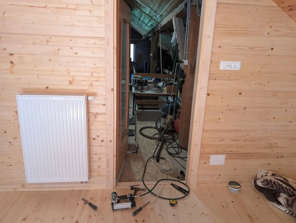 Installing the first piece of casing on the main entry door.