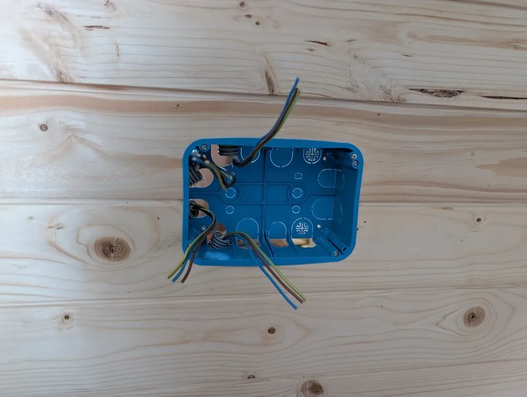 Pre-formed holes in the box make it easy to lead in electrical wiring from any direction. Above goes to the panel, down goes into the floor and on to the loads.