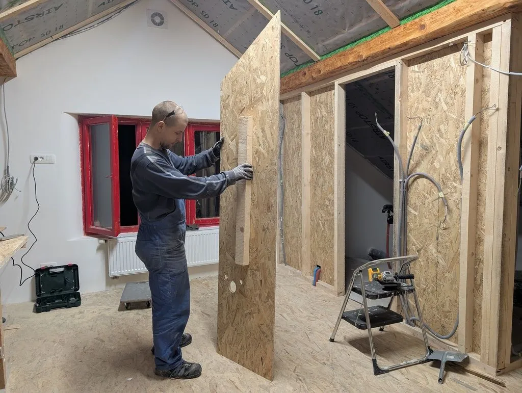 I attached a temporary "handle" to the back of the final piece of sheathing to allow me to maneuver it into place.