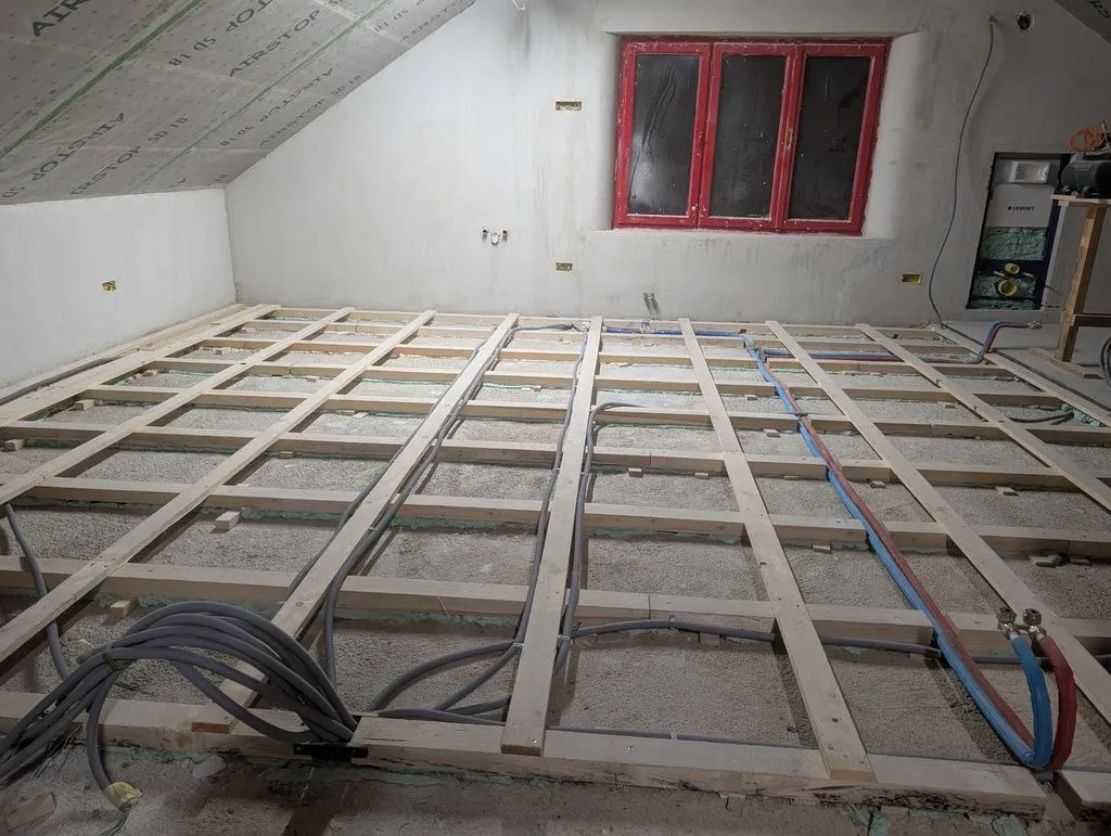 Done! The cleaned-out subfloor, ready for insulation and the subfloor.