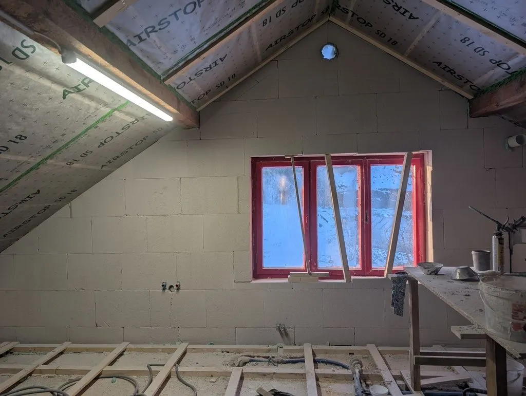 The second layer of Multipor freshly installed, with adhesive still curing.