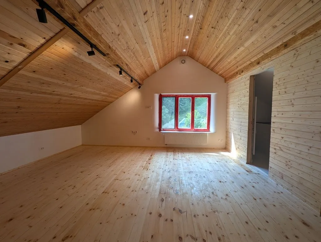 The sealed floor, still largely its natural color and luster, as desired.