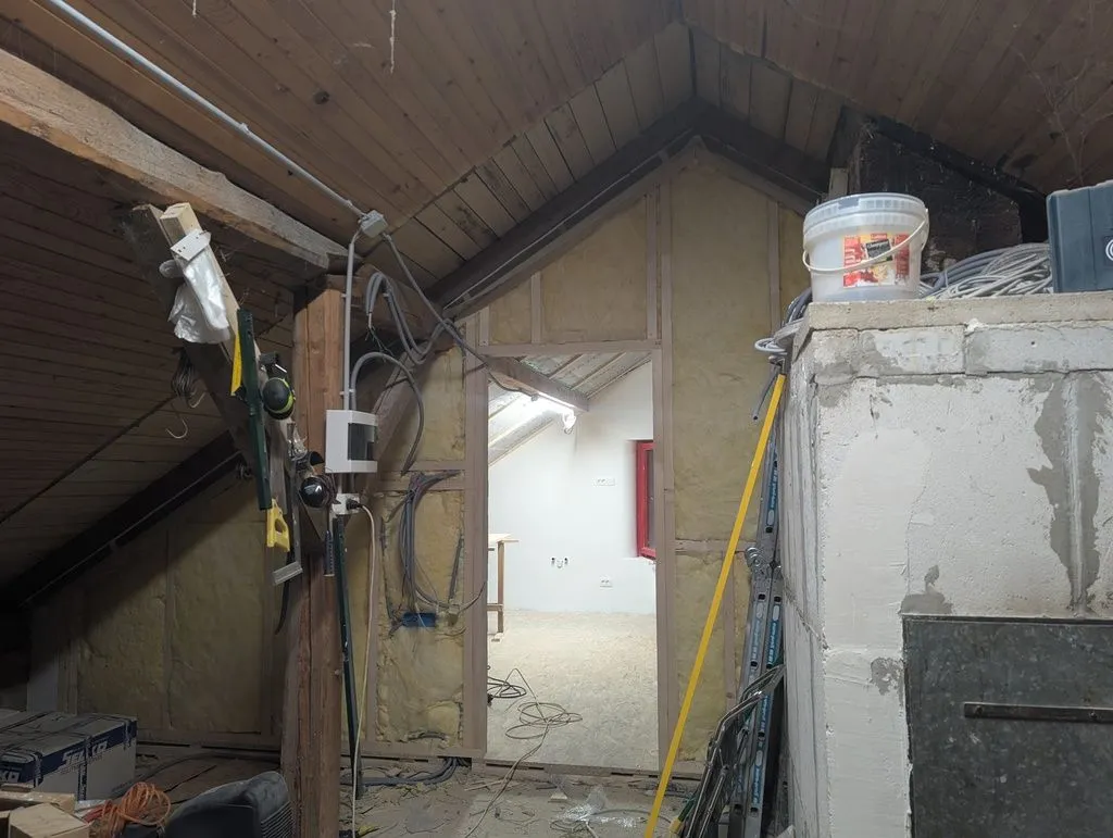 All done! The insulation installed in the main partition wall, which is now ready for the tongue and groove wall finish, installed next.