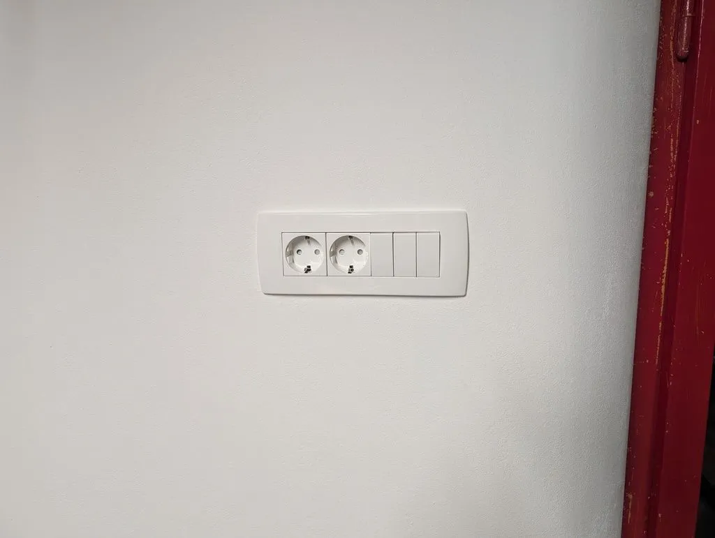 The completed outlet and switch box, with the cover plate installed.