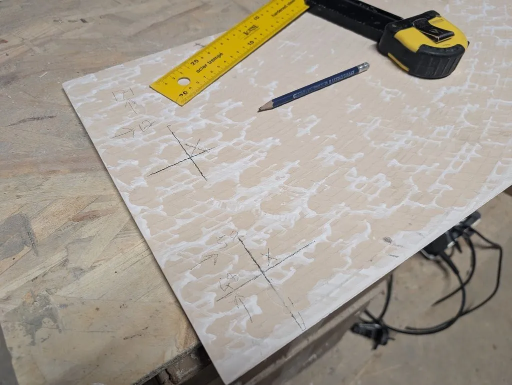 Marking the position for the magnets on the back of the blind tile.