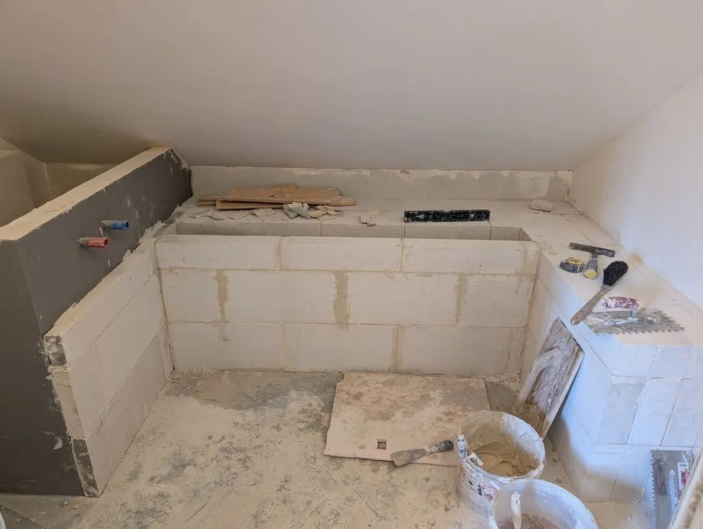 The (nearly complete) bathtub enclosure. I would later add the front wall and fill in the small trench in the flat area in the back.