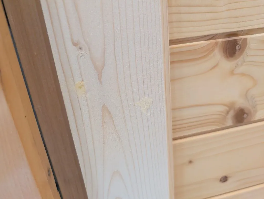 The casings are attached with 18 gauge brad nails; the nail holes are filled with wood filler...