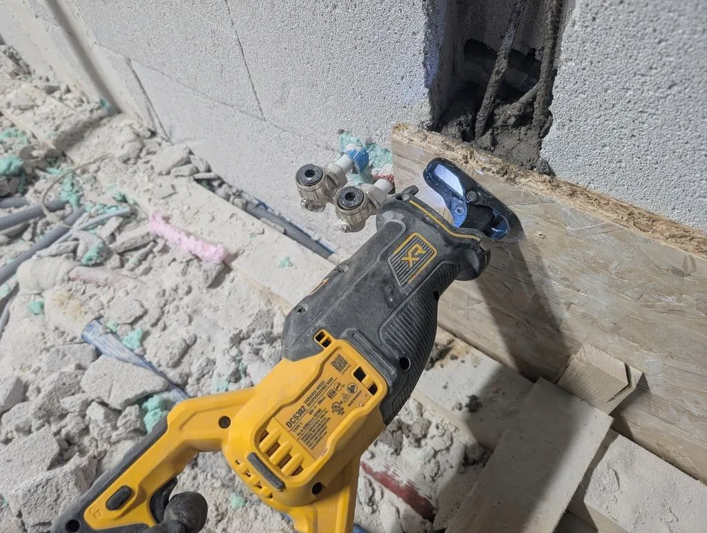 A sawzall with the blade removed makes for a great concrete vibrator.