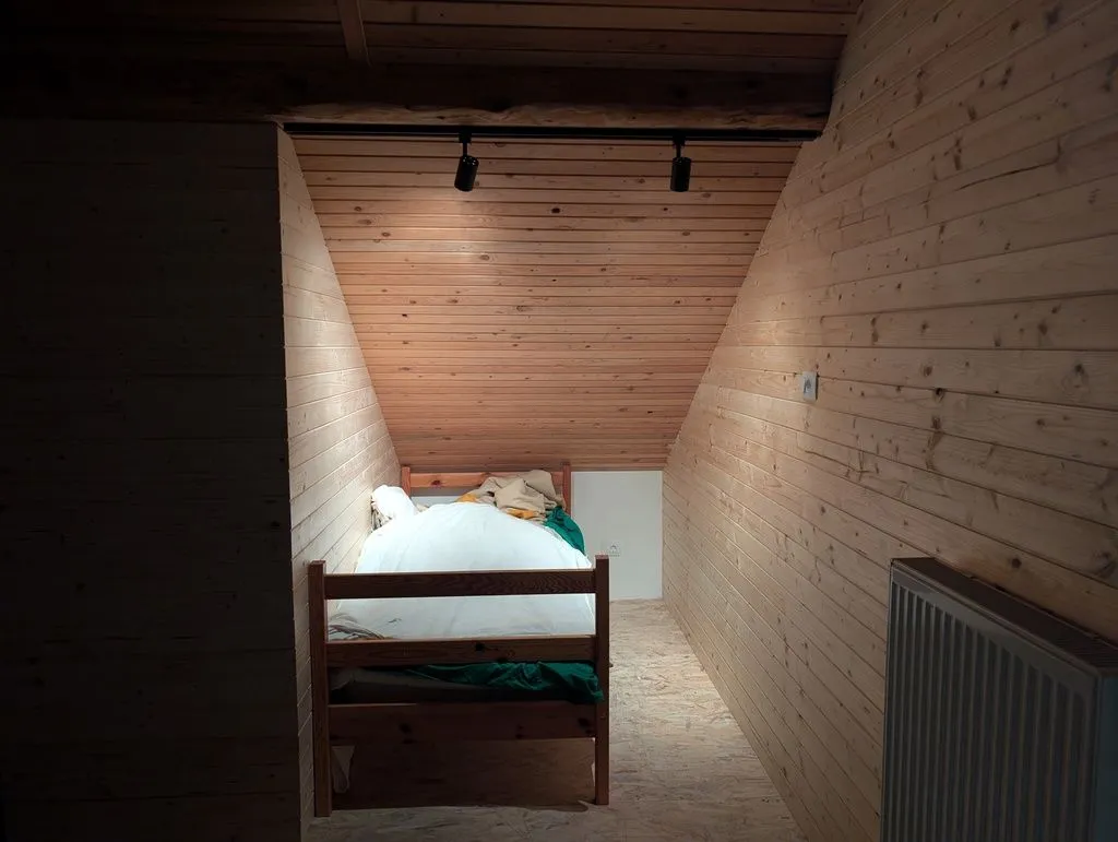 The installed track lights. A three-way switch by the bed lets you turn the lights off from in bed.