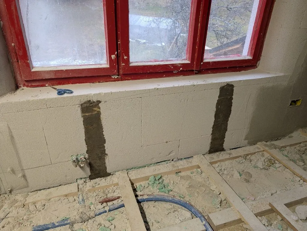 The cured concrete support posts, ready to support a future radiator.
