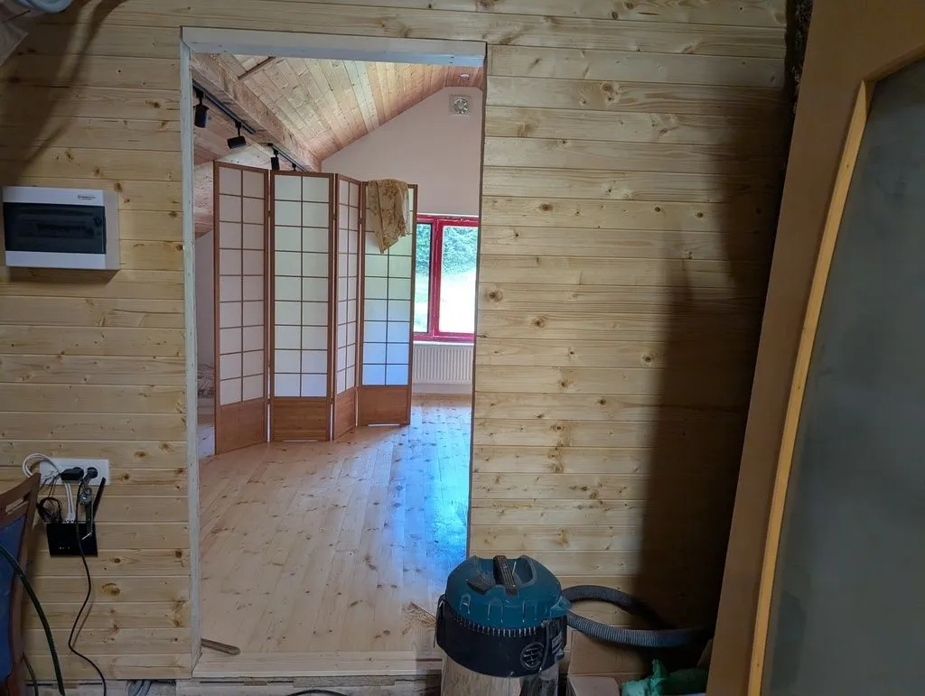 The rough opening for the main entry door into the attic living space.