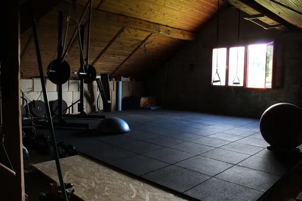 Framework of elastic sleepers build to support the gym's floor.