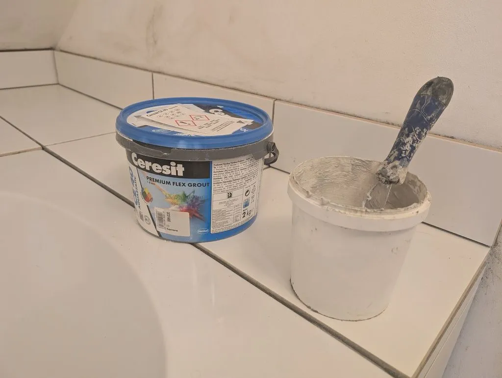 We grouted the tile with a flexible off-white CE-40 grout made by Ceresit.