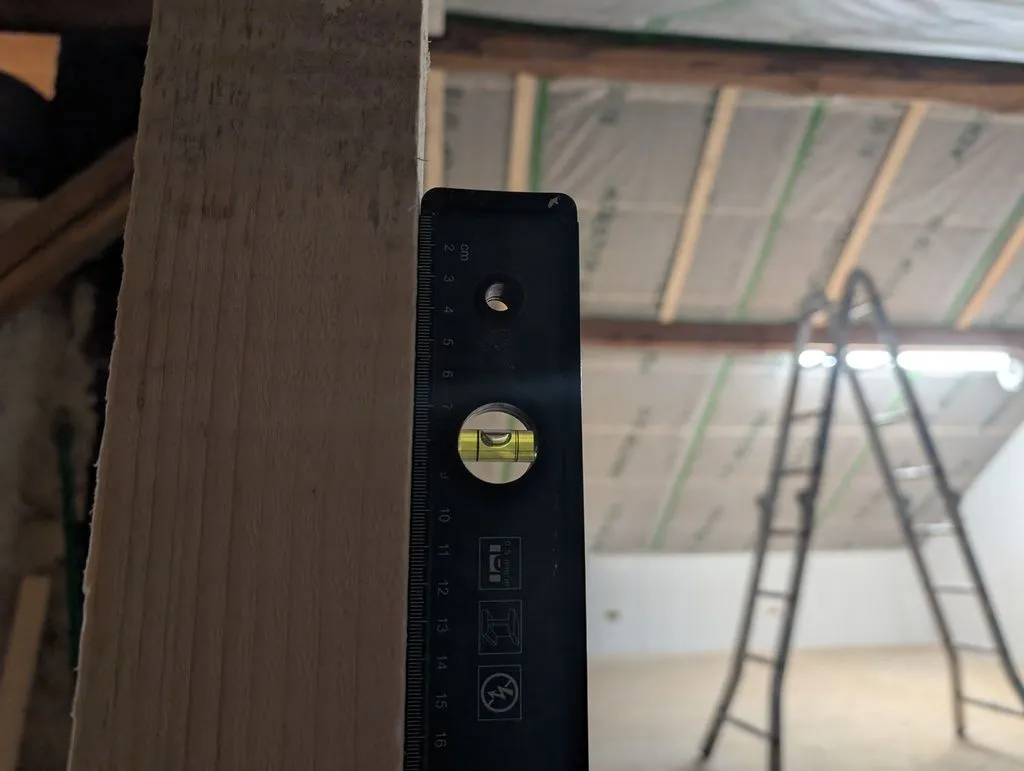 Verifying the studs are level.