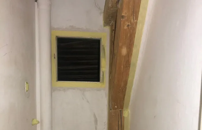 Masking tape applied to timbers and window trim.