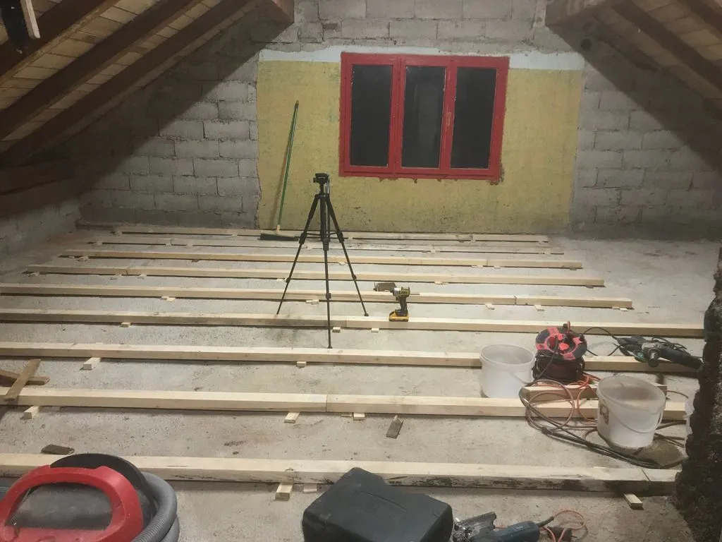 Nearing completion of the sleepers. The tripod held the laser level that we used to level the sleepers.