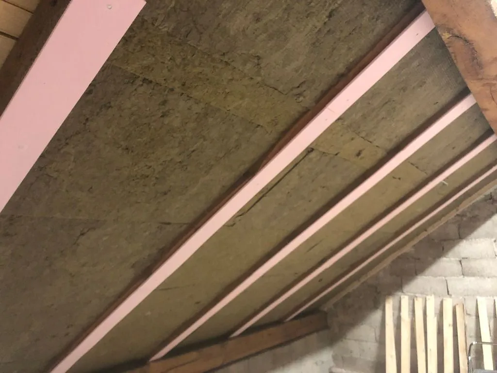 We furred out the 140 mm rafters with 10 mm of XPS to match the final thickness of the rock wool; besides equalizing depths of rafters and insulation, the XPS has the additional benefit of decreasing thermal bridging.